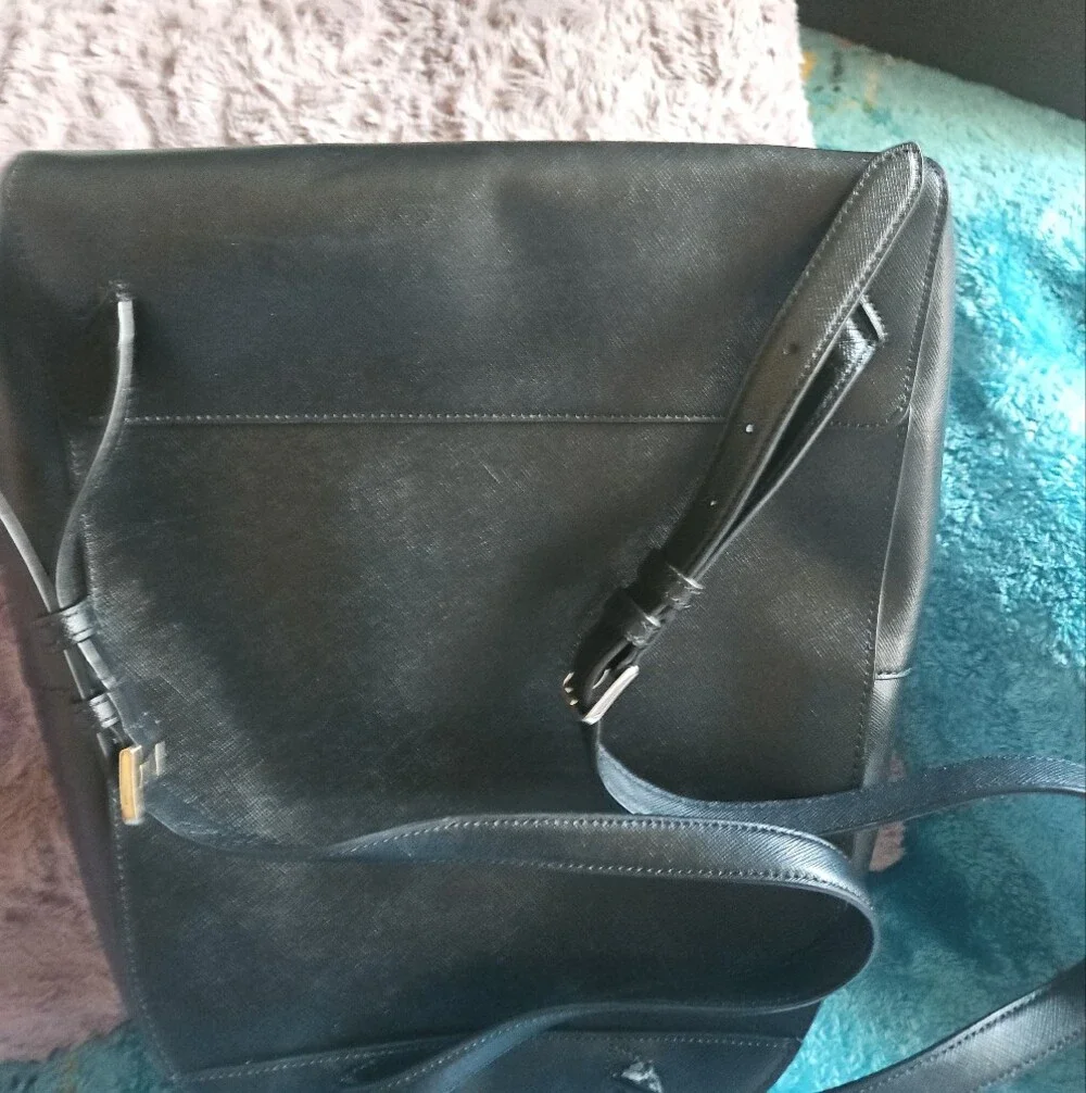 AS-IS Kate Spade black leather backpack LEFT STRAP AT THE TOP TORN. STILL NEW